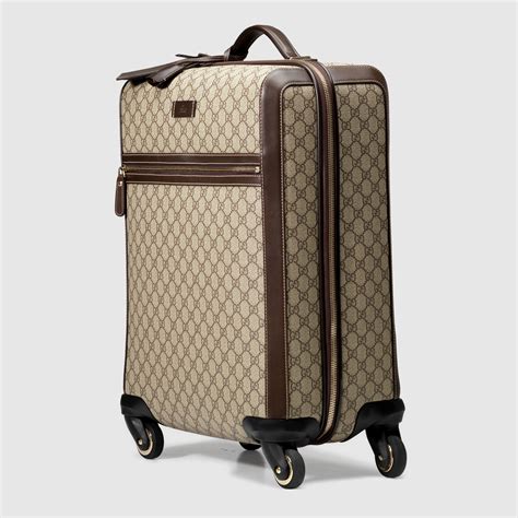 gucci suitcase with wheels.